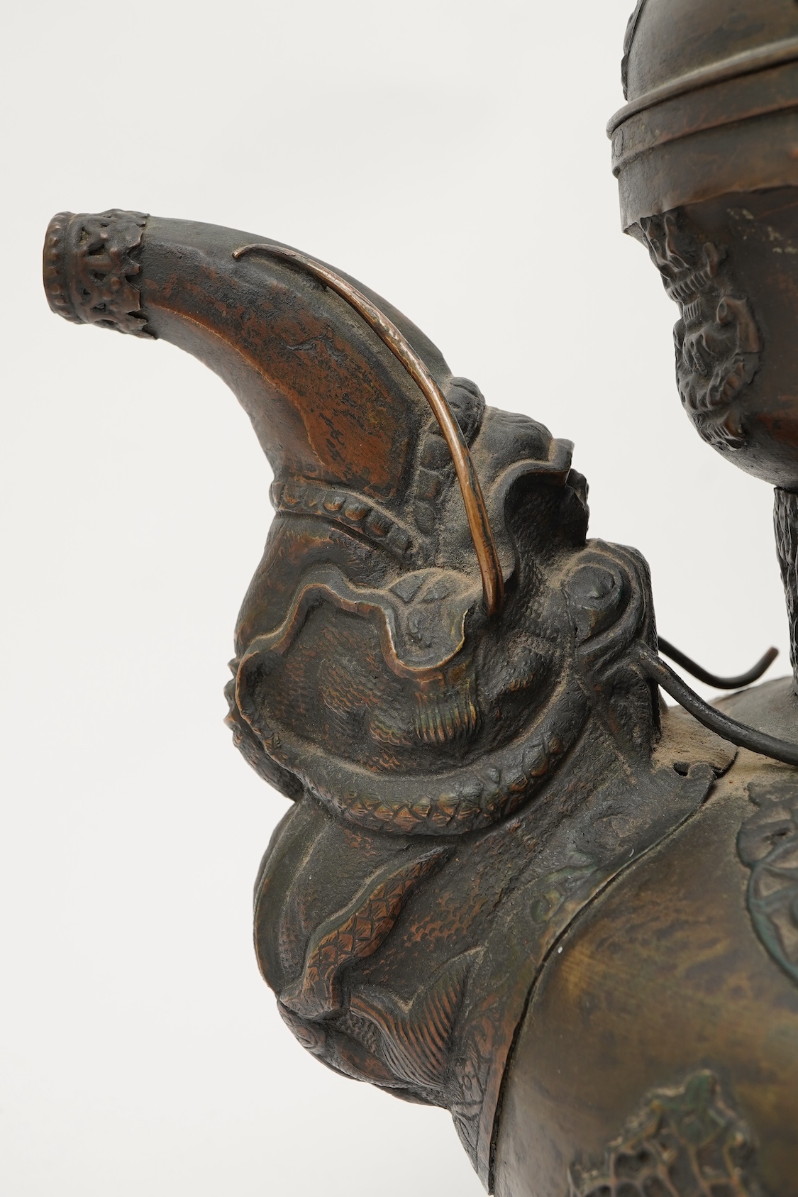 A large Tibetan repoussé brass and copper ewer, 19th century